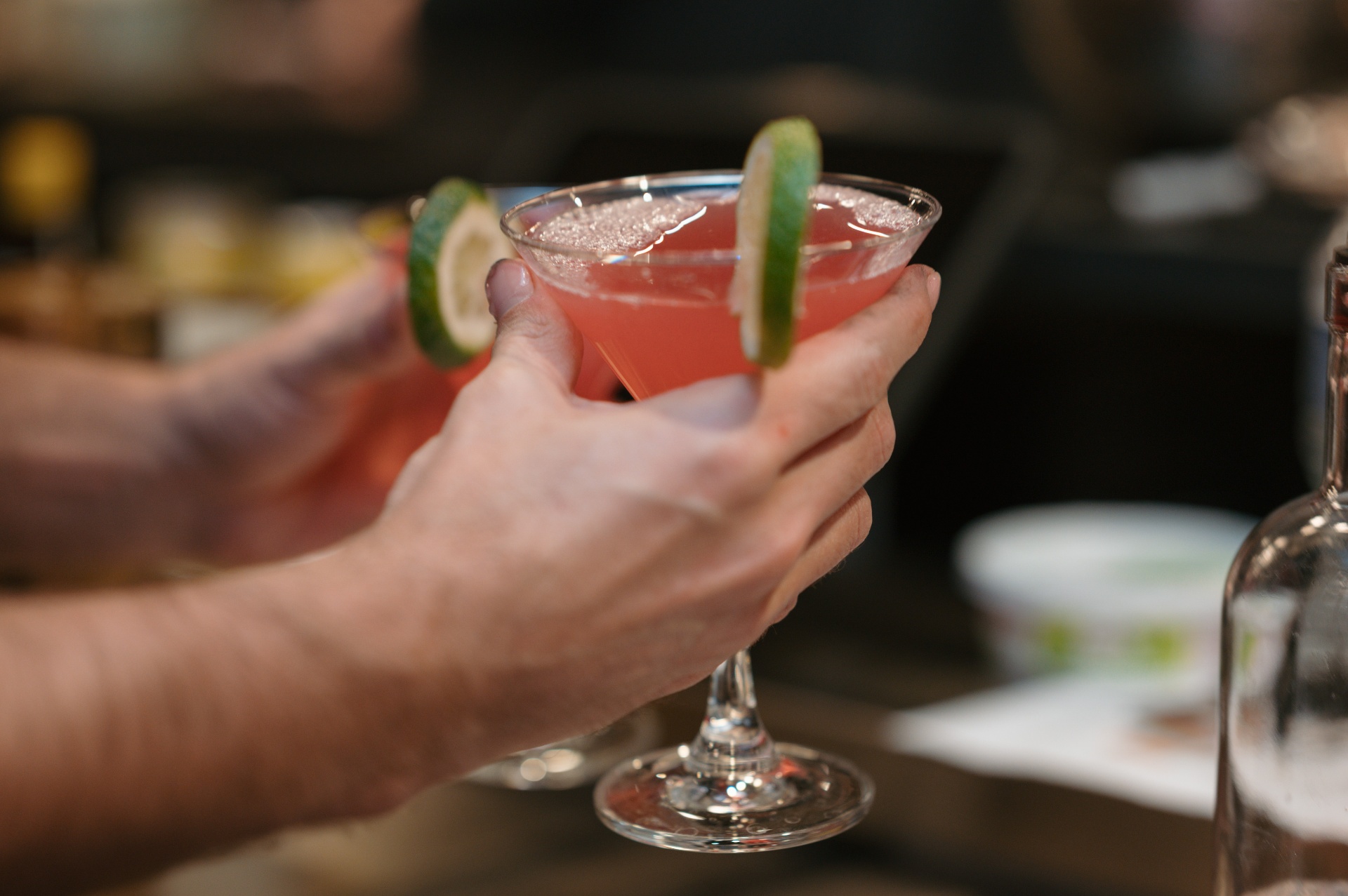 Toasting craft cocktails at the bar