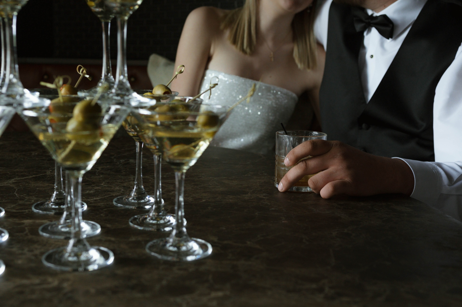 Bride and groom at the Speakeasy bar with martinis