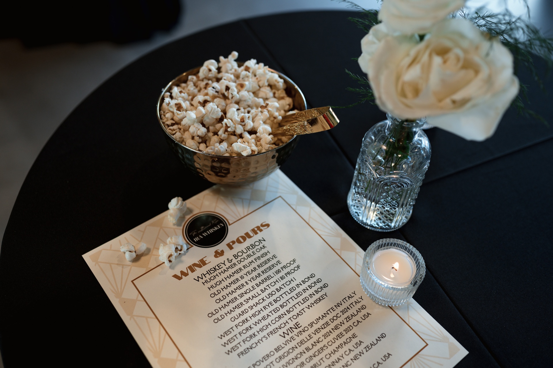 Wine & Pours menu with popcorn and roses